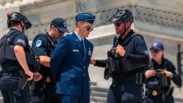 Major Watson arrested on the U.S. Capitol steps